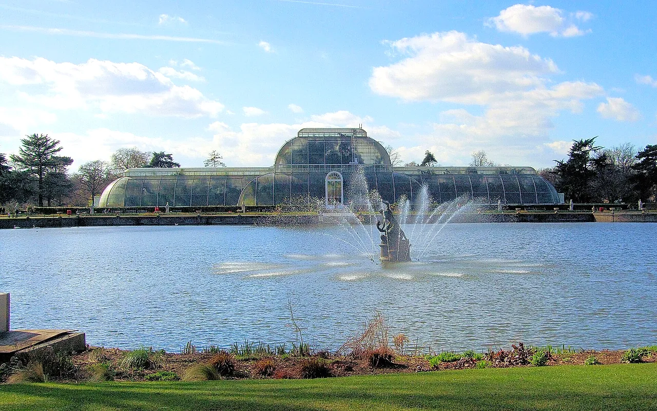 The Palm House across the lake, with the fountain playing in the foreground water