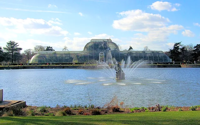 The Palm House across the lake, with the fountain playing in the foreground water